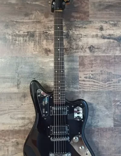Exposición en pared de guitarra Fender Jaguar HH Black